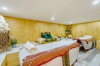 BeautyPac treatment room with a white-covered treatment bed.