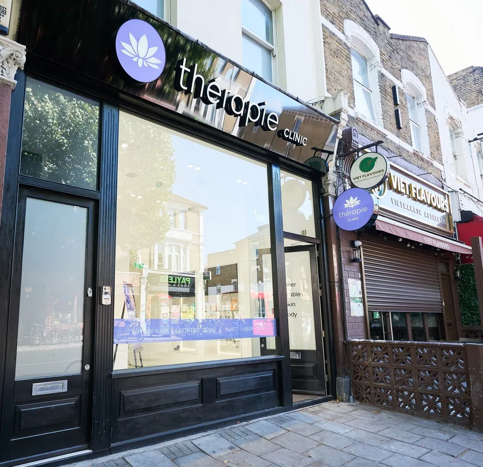 Thérapie Clinic Dulwich shopfront on Lordship Lane with its purple projecting sign