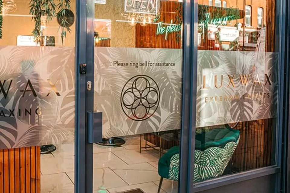 LuxWax Crouch End glazed entrance with salon lettering and doorbell.