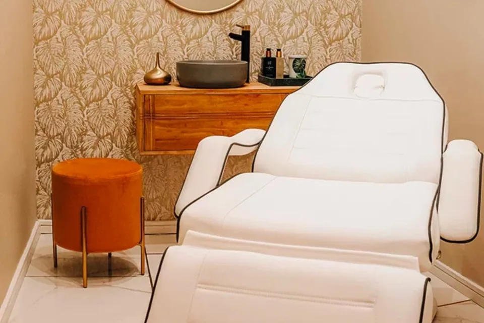 Treatment chair, washbasin and patterned wall at LuxWax Crouch End.