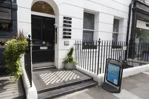 Building entrance and steps at 5 Percy Street for Pulse Light Clinic