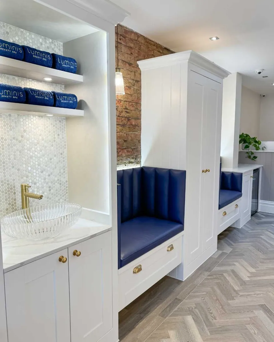 Blue pedicure seating and white cabinetry at Luminis Chislehurst.