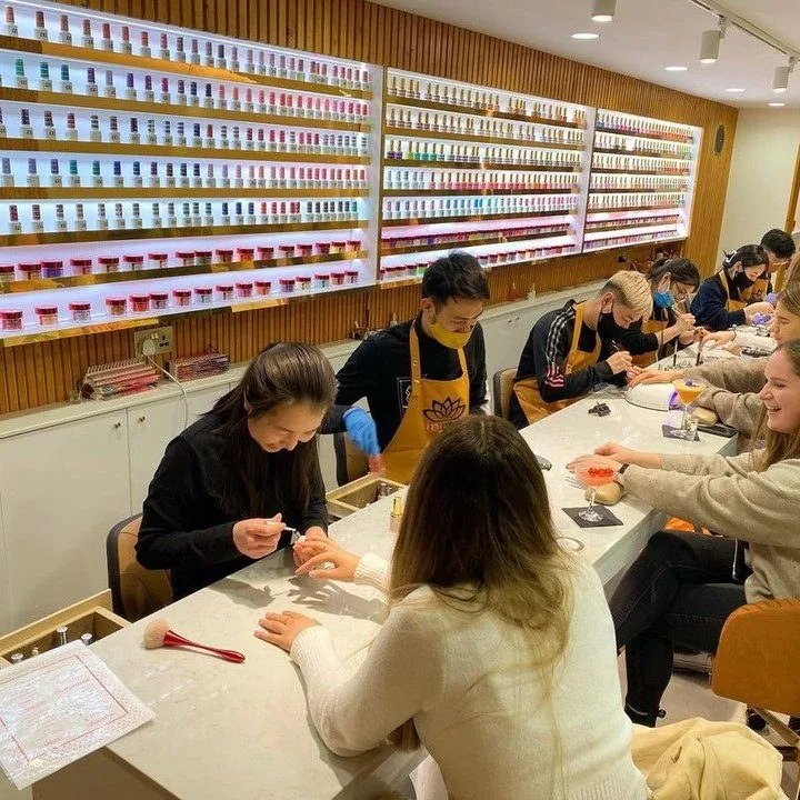 Manicure stations and polish displays inside Le Lotus Putney