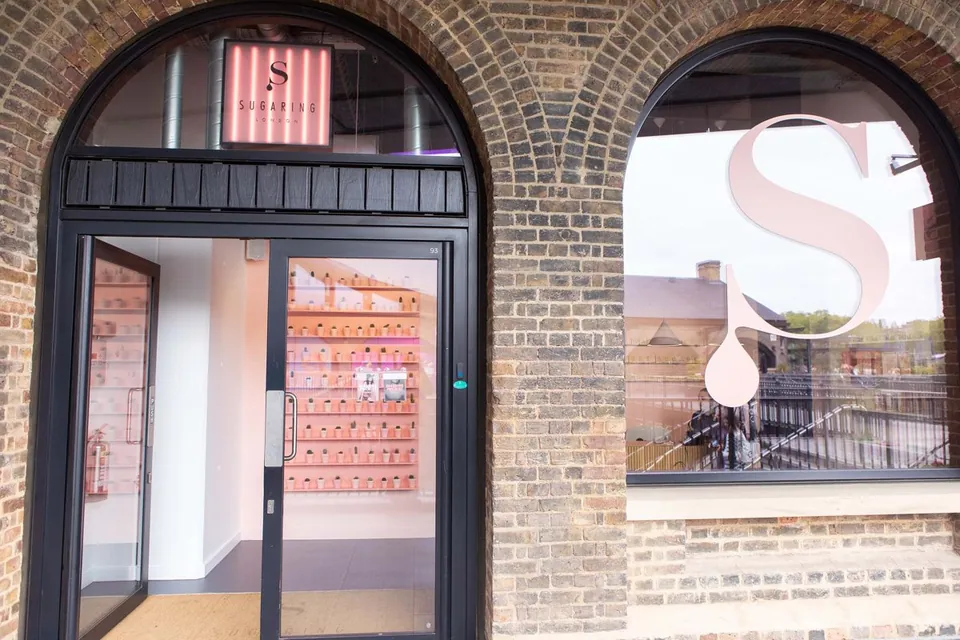 Sugaring London entrance beneath the Coal Drops Yard brick arches